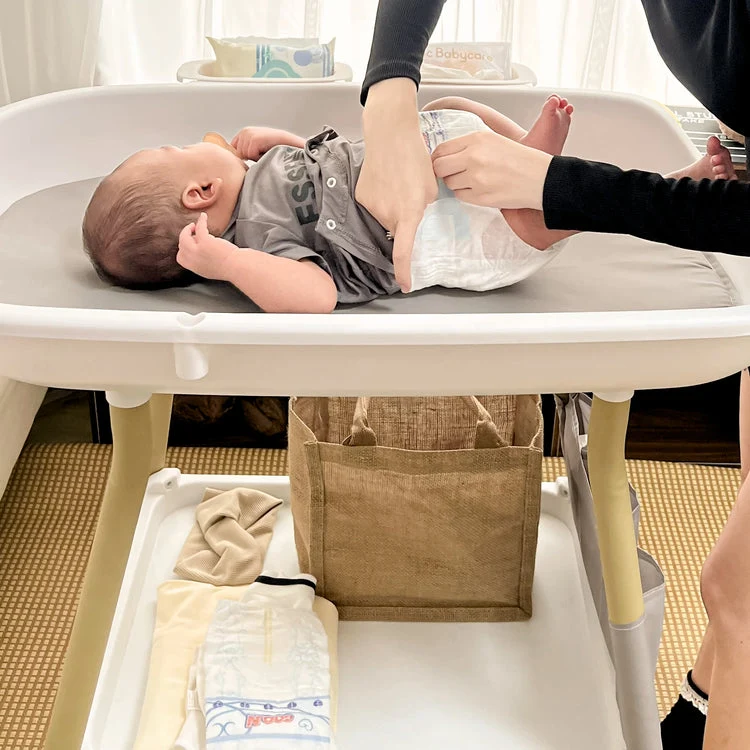 Table à langer et baignoire pour bébé 2 en 1